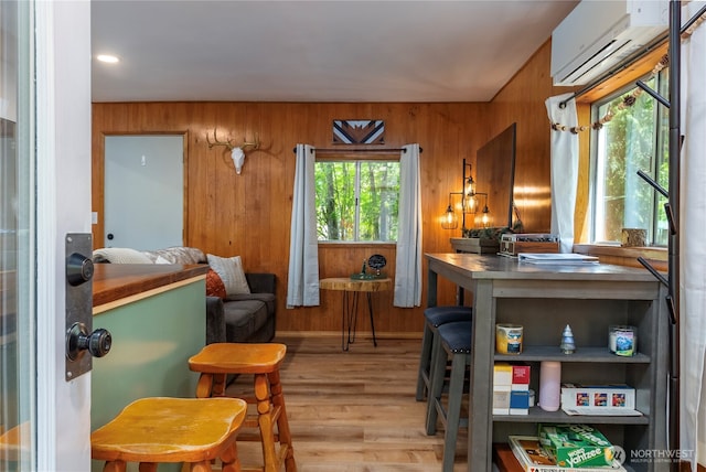105 Robinwood Pl, Packwood, WA 98361 - sitting room featuring a wall mounted AC, wood finished floors, and wood walls