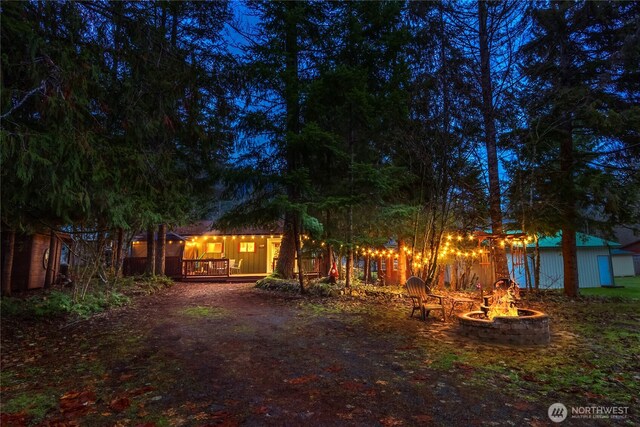 105 Robinwood Pl, Packwood, WA 98361 - back of house featuring an outdoor fire pit