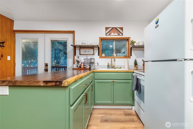 105 Robinwood Pl, Packwood, WA 98361 - kitchen featuring open shelves, green cabinets, a sink, and white appliances
