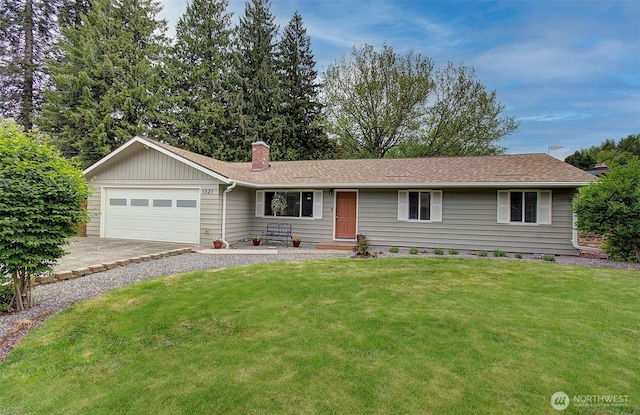 ranch-style house with roof with shingles, an attached garage, a front lawn, a chimney, and driveway