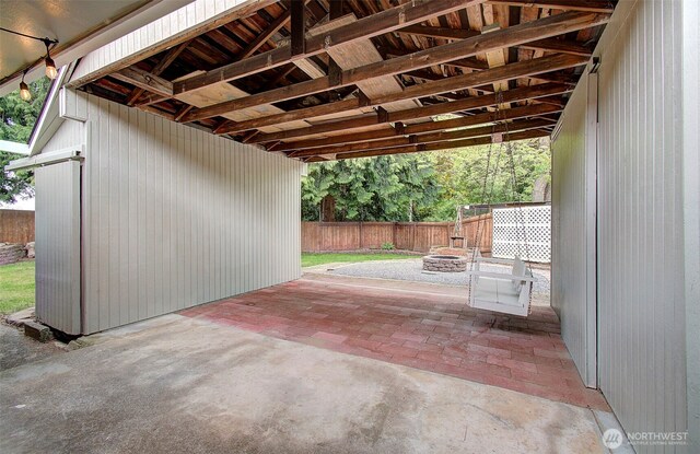 view of patio featuring fence and an outdoor fire pit