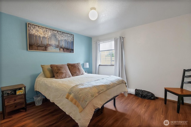 bedroom with wood finished floors