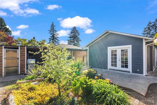 view of home's exterior featuring a patio and french doors