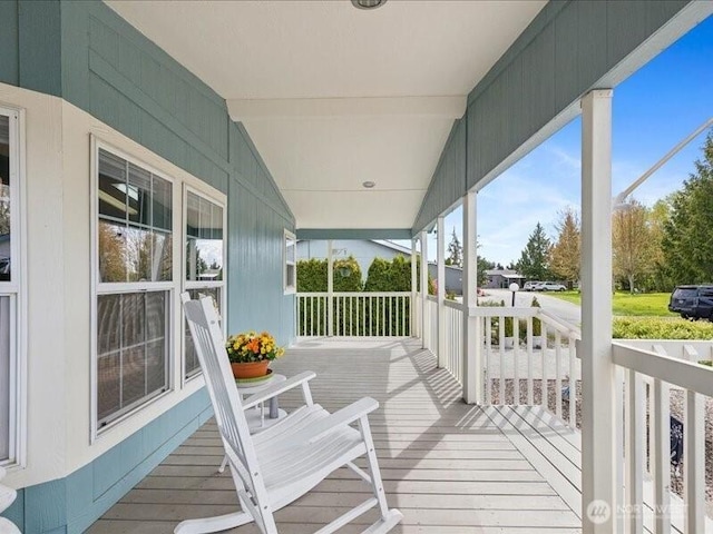 wooden terrace with a porch