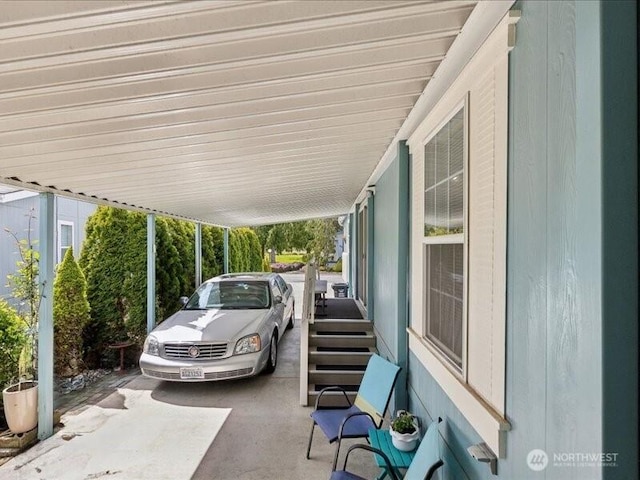 view of parking / parking lot featuring a carport