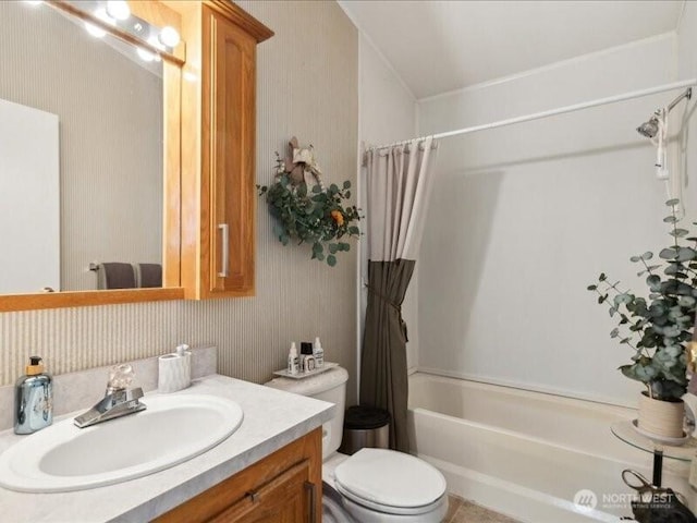 full bath featuring shower / tub combo, wallpapered walls, vanity, and toilet