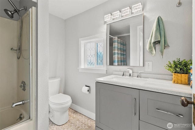 bathroom with vanity, baseboards, tile patterned floors, toilet, and shower / bathtub combination with curtain