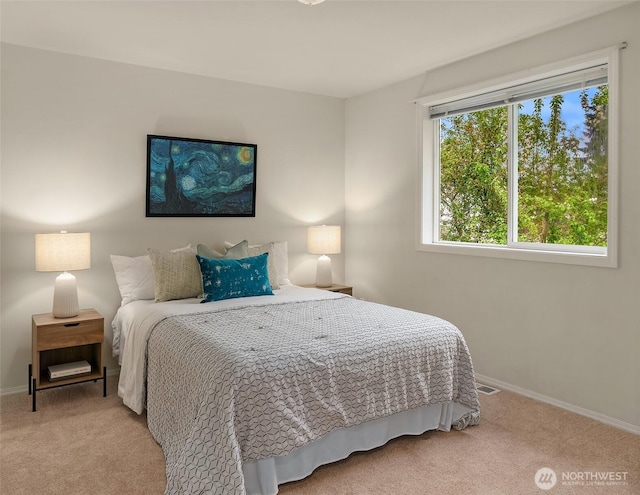 carpeted bedroom with baseboards