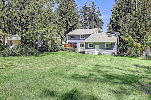 366 Tillicum Way, Camano Island, WA 98282 - view of front facade with board and batten siding, a shingled roof, and a front yard