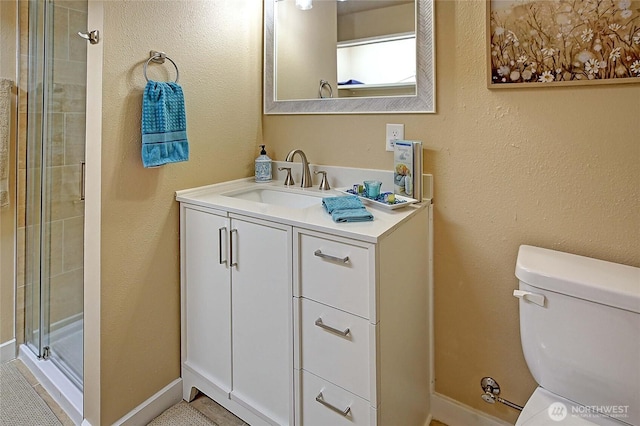 366 Tillicum Way, Camano Island, WA 98282 - bathroom featuring toilet, baseboards, vanity, and a stall shower
