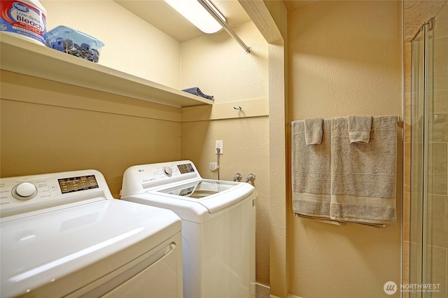 366 Tillicum Way, Camano Island, WA 98282 - laundry room with laundry area, separate washer and dryer, and a textured wall