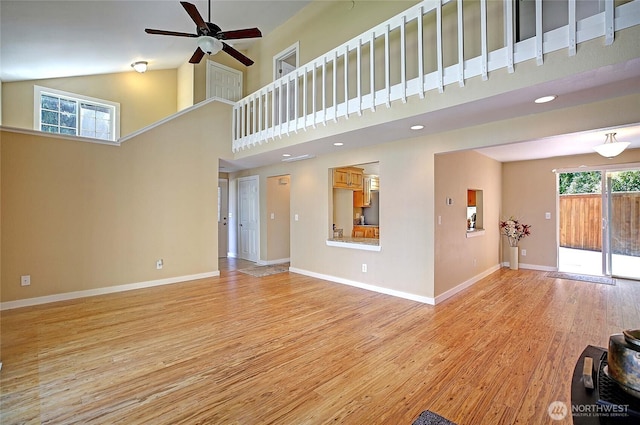 366 Tillicum Way, Camano Island, WA 98282 - unfurnished living room featuring high vaulted ceiling, recessed lighting, light wood-style flooring, a ceiling fan, and baseboards