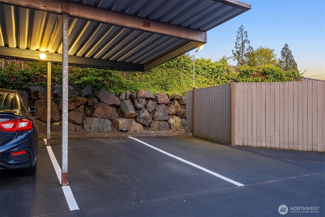 covered parking lot with fence