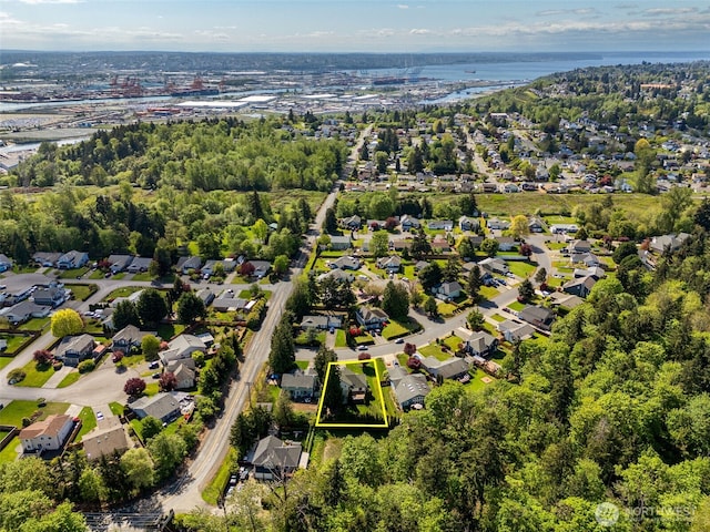birds eye view of property featuring a residential view and a water view
