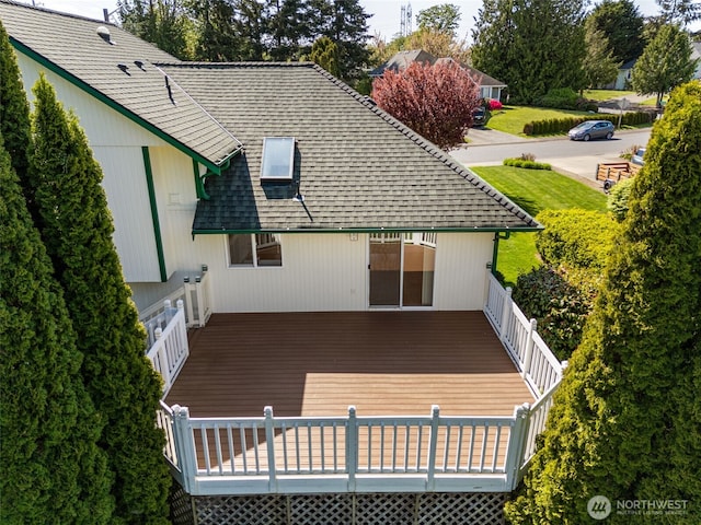 back of house featuring a deck