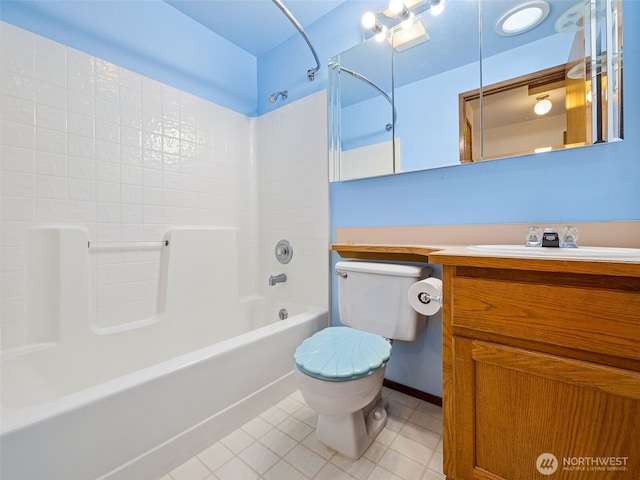 bathroom with toilet, tile patterned floors,  shower combination, and vanity