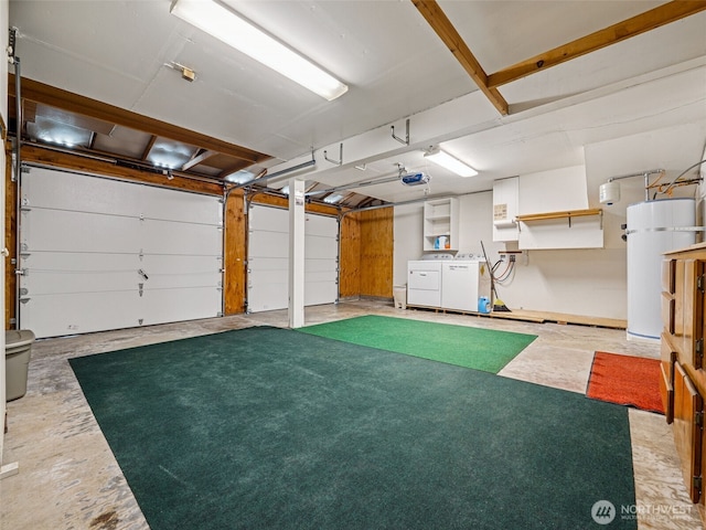 garage with strapped water heater, a garage door opener, and washing machine and dryer