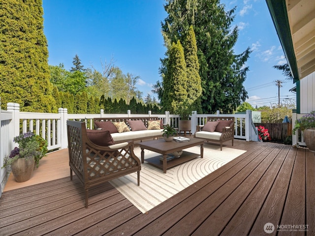 wooden terrace featuring an outdoor living space