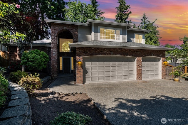 11628 NE 100th St, Kirkland, WA 98033 - view of front of property with brick siding, concrete driveway, and a garage