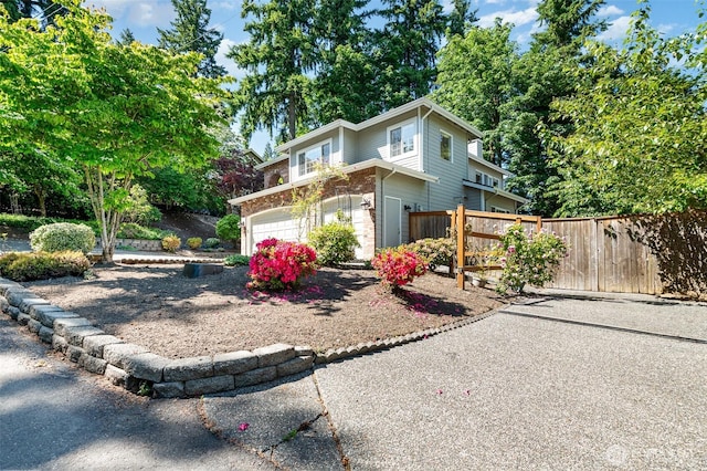 11628 NE 100th St, Kirkland, WA 98033 - traditional home with an attached garage and brick siding