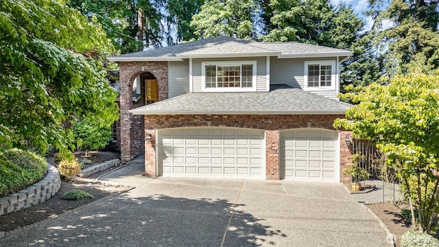 11628 NE 100th St, Kirkland, WA 98033 - traditional-style home featuring a garage, concrete driveway, brick siding, and a shingled roof