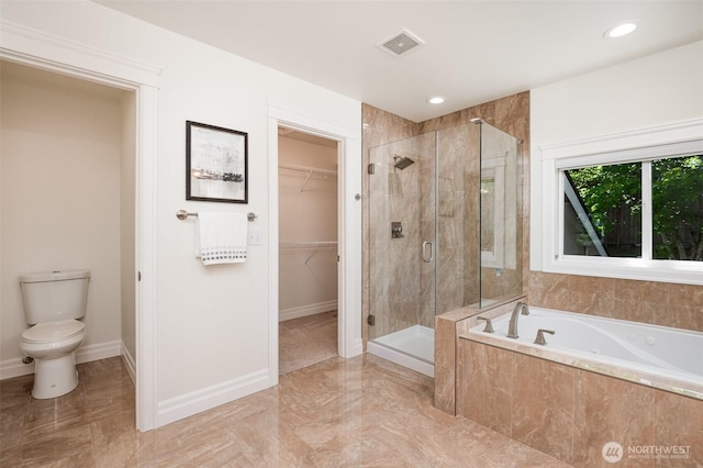 11628 NE 100th St, Kirkland, WA 98033 - full bathroom featuring toilet, a garden tub, a stall shower, a spacious closet, and baseboards