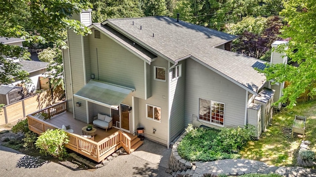 11628 NE 100th St, Kirkland, WA 98033 - back of house featuring a chimney, roof with shingles, and a wooden deck