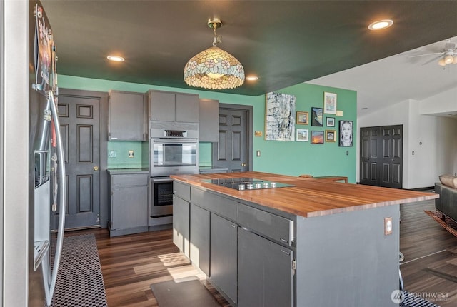 51 Vista Blvd, Port Townsend, WA 98368 - kitchen with wood counters, stainless steel double oven, gray cabinets, black electric stovetop, and recessed lighting