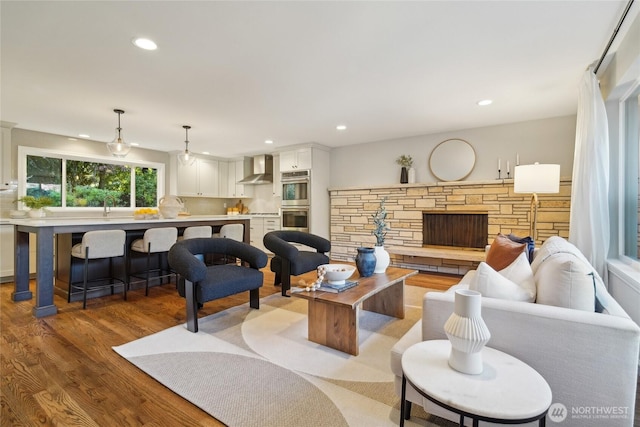 living room featuring recessed lighting and wood finished floors