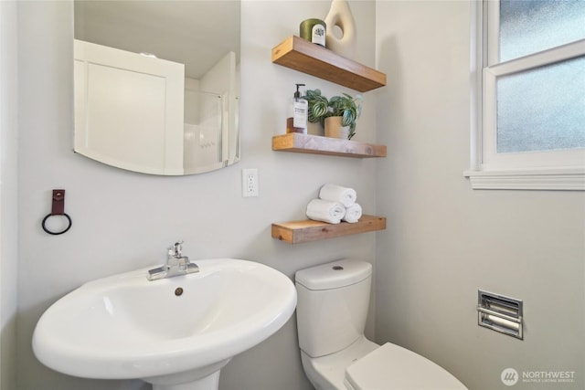 bathroom featuring a sink and toilet