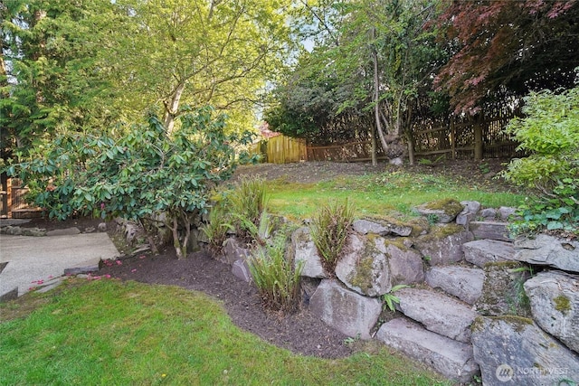 view of yard with fence