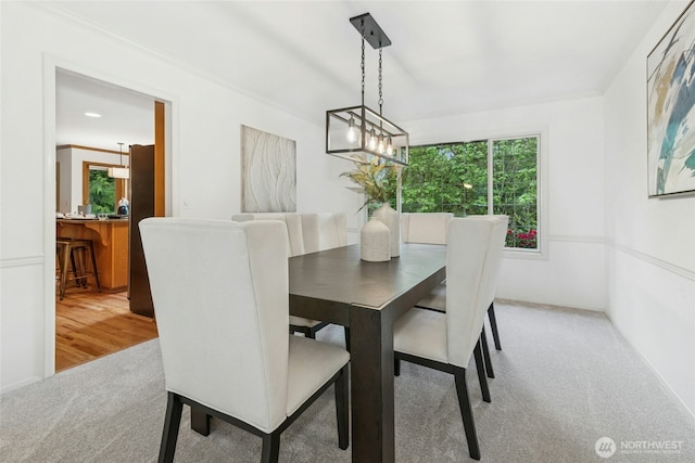 26006 NE 27th Dr, Redmond, WA 98053 - dining room featuring carpet flooring, a notable chandelier, and a healthy amount of sunlight
