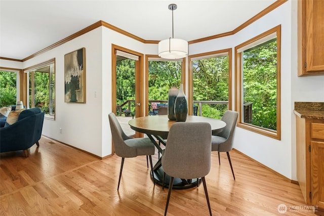 26006 NE 27th Dr, Redmond, WA 98053 - dining space with baseboards, light wood finished floors, and crown molding