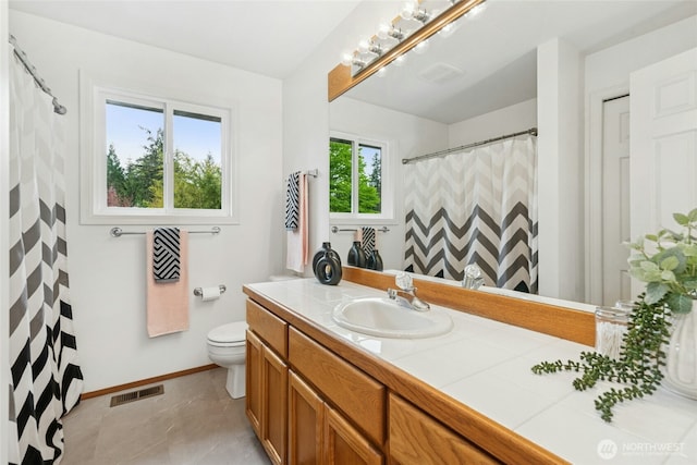 26006 NE 27th Dr, Redmond, WA 98053 - full bath with vanity, toilet, baseboards, curtained shower, and visible vents