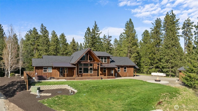 view of front of property featuring board and batten siding and a front yard