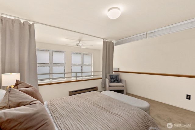 bedroom featuring baseboards and carpet