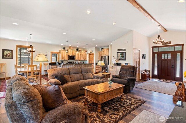 living room featuring recessed lighting, a notable chandelier, lofted ceiling with beams, and dark wood finished floors