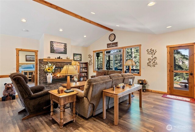 living area featuring vaulted ceiling with beams, baseboards, recessed lighting, and wood finished floors