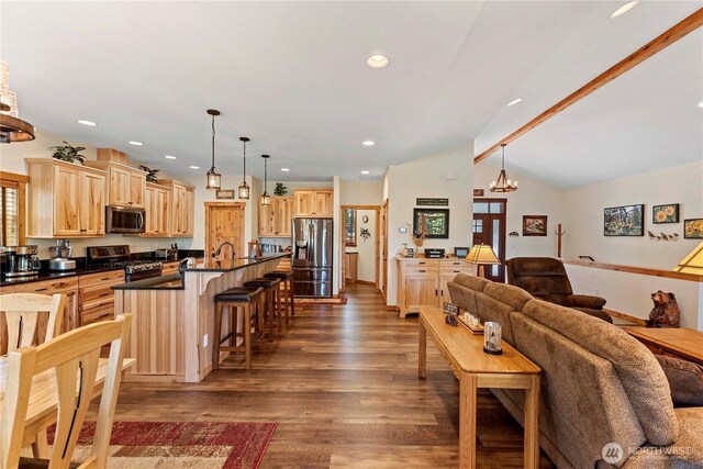 living room with recessed lighting, vaulted ceiling with beams, dark wood finished floors, and a chandelier