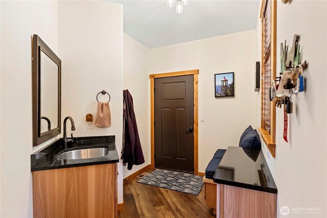 entrance foyer featuring baseboards and dark wood-style floors
