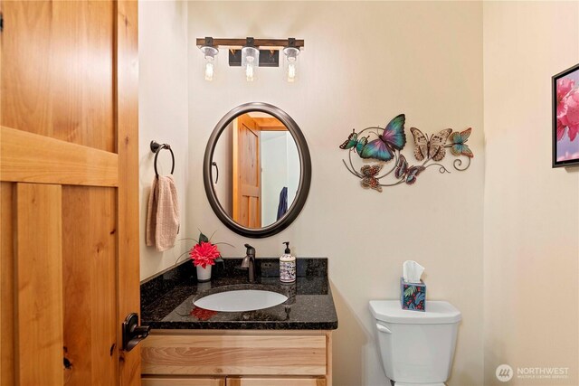 bathroom with vanity and toilet