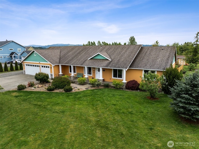 single story home with a porch, driveway, roof with shingles, a garage, and a front lawn