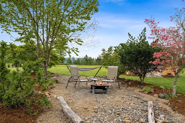 view of yard featuring a fire pit