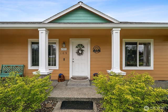 doorway to property with a porch