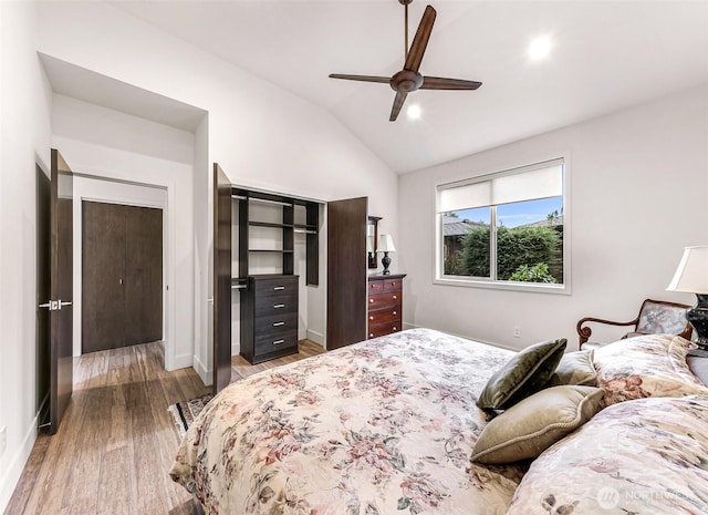 bedroom featuring ceiling fan, vaulted ceiling, wood finished floors, baseboards, and recessed lighting