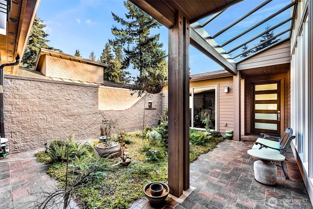 view of patio / terrace featuring fence
