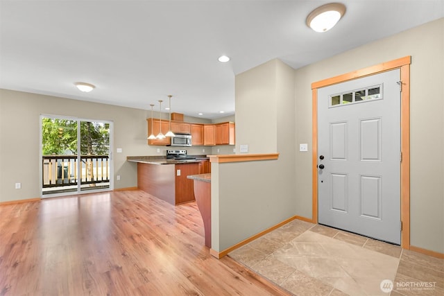 1321 Wilson Ave, Blaine, WA 98230 - entryway with baseboards, light wood-style floors, and recessed lighting