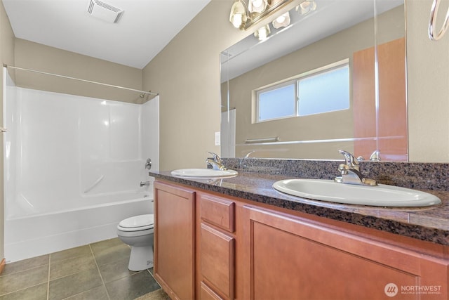 1321 Wilson Ave, Blaine, WA 98230 - bathroom featuring toilet, washtub / shower combination, double vanity, and tile patterned floors