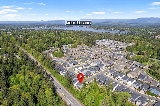 1616 96th Dr SE, Lake Stevens, WA 98258 - aerial overview of property's location featuring a forest, a water and mountain view, and nearby suburban area