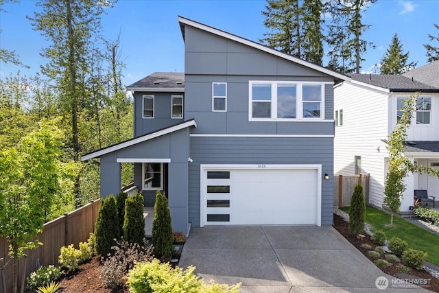 1616 96th Dr SE, Lake Stevens, WA 98258 - contemporary house featuring fence, concrete driveway, an attached garage, and roof with shingles